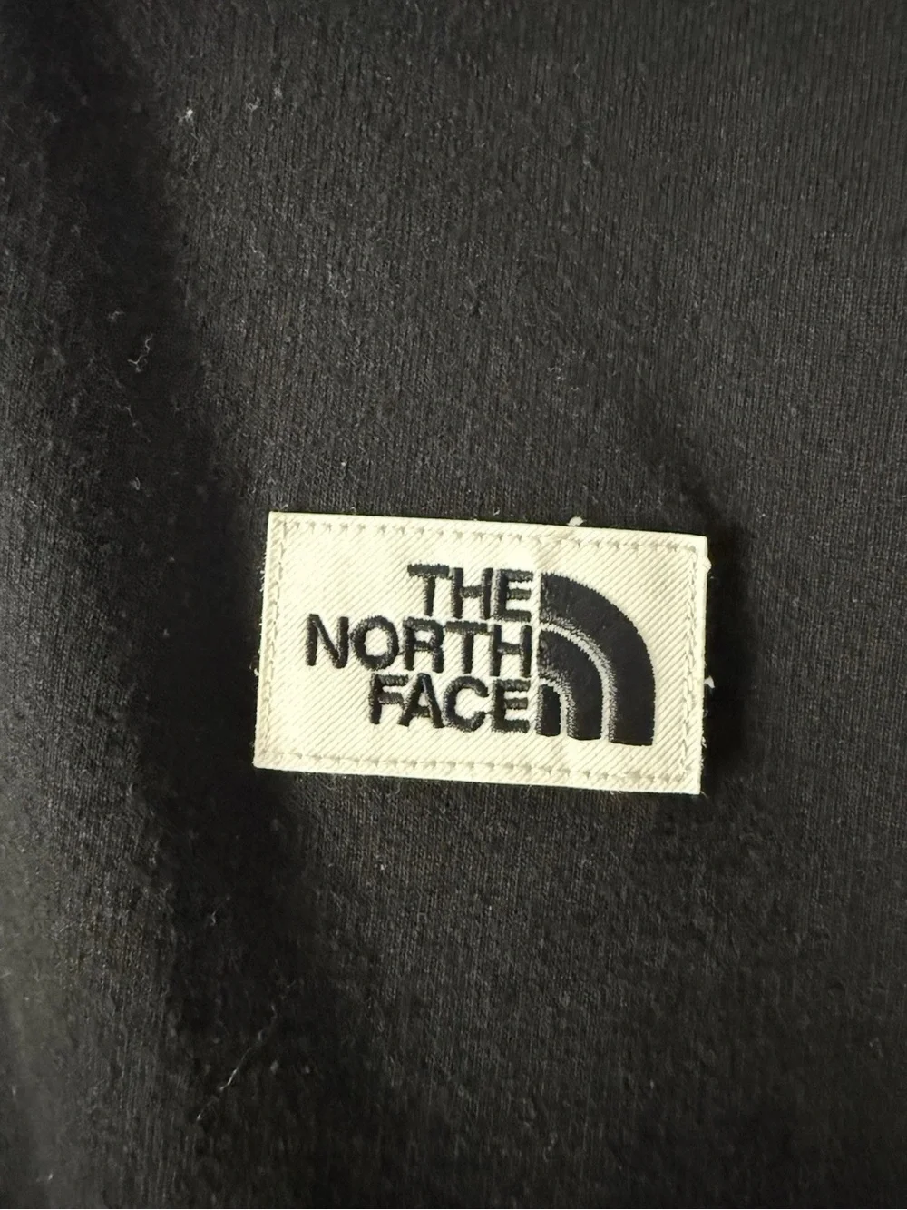 The North Face Black Crewneck Sweatshirt with Small Logo Patch